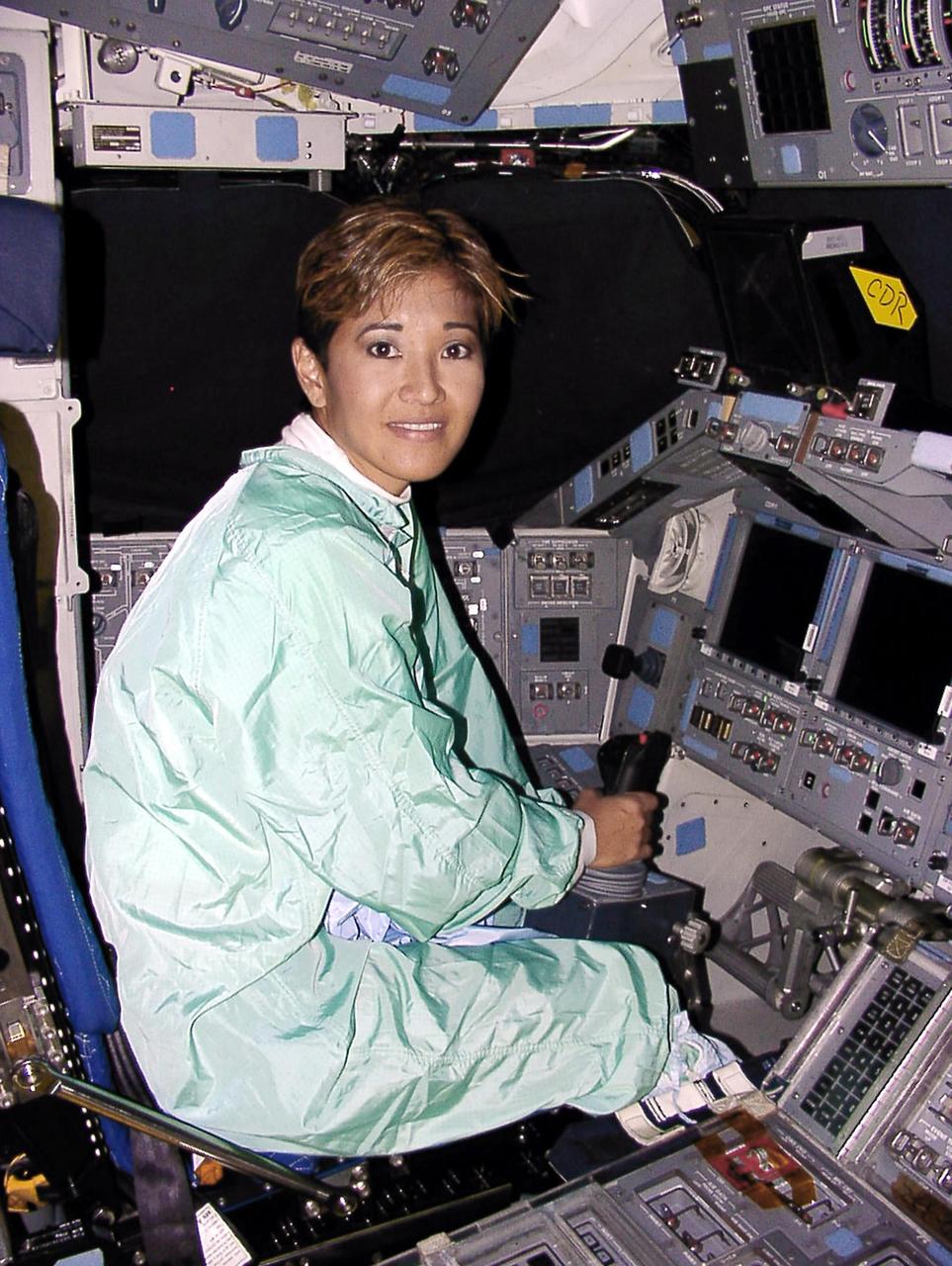 WESH-TV 2 News Anchor Wendy Chioji sits in the cockpit of a space shuttle while touring Kennedy Space Center.