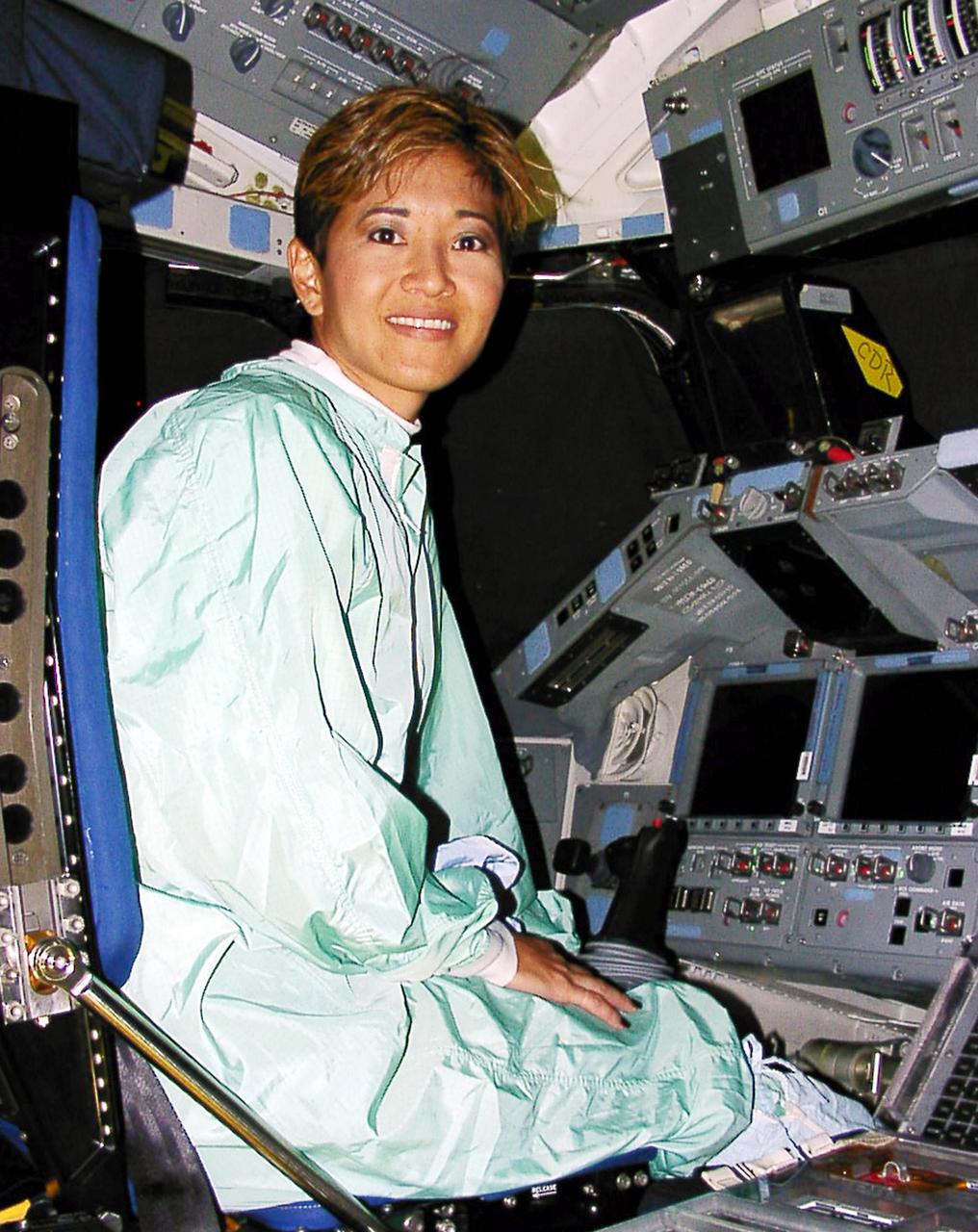 WESH-TV 2 News Anchor Wendy Chioji sits in the cockpit of a space shuttle while touring Kennedy Space Center.