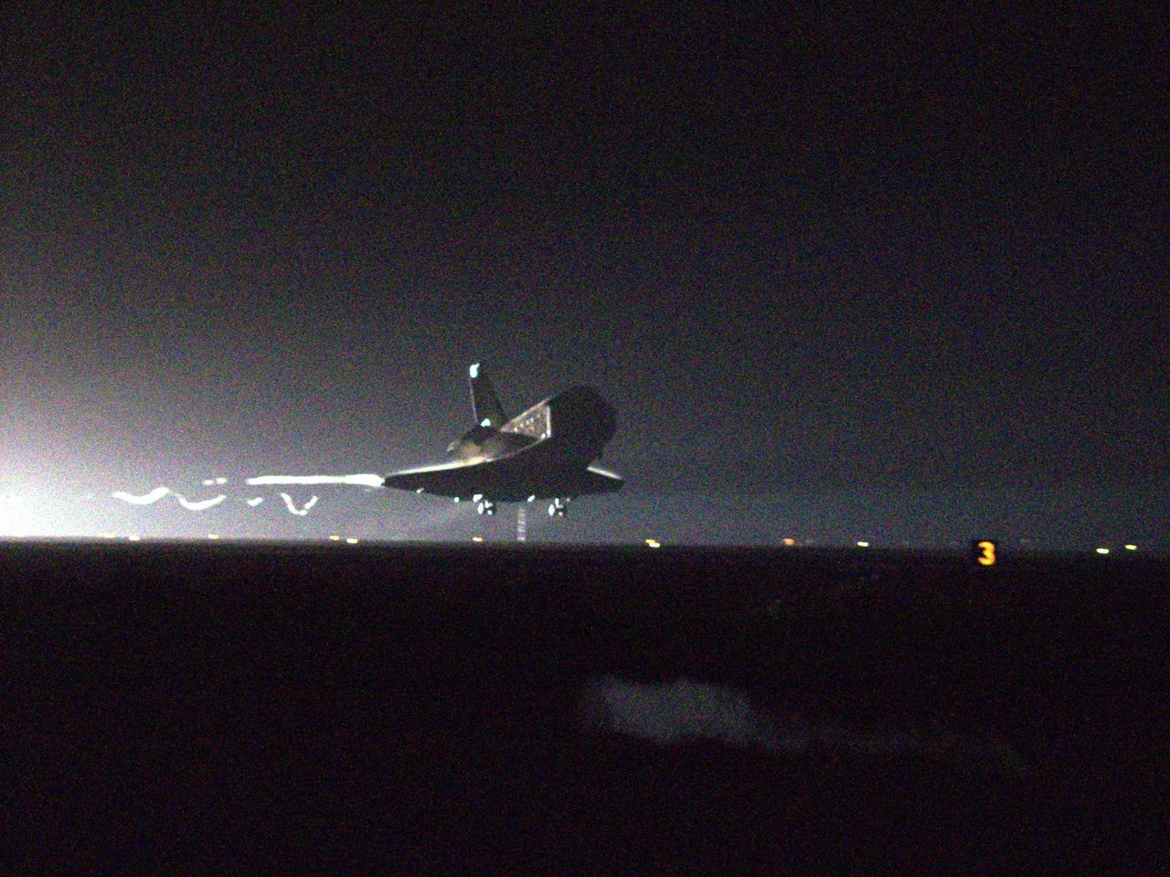 KENNEDY SPACE CENTER, FLA. -- Orbiter Columbia, with its crew of seven, approaches touchdown on Runway 33 of the KSC Shuttle Landing Facility, completing mission STS-109 to service the Hubble Space Telescope. Wheel stop occurred on orbit 165 at 4:33:09 a.m. EST with mission elapsed time of 10 days, 22 hours, 11 minutes. Main gear touchdown occurred at 4:31:52 a.m. and nose wheel touchdown an 4:32:02. It was the 58th landing at KSC out of 108 missions in the history of the Shuttle program