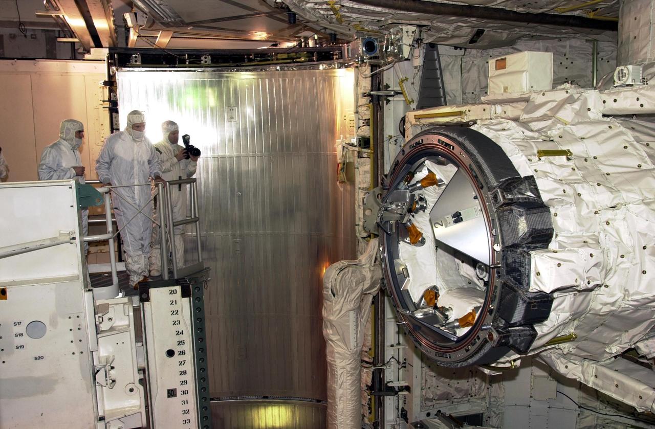 KENNEDY SPACE CENTER, FLA. -- In the Payload Changeout Room at the pad, STS-110 crew members perform a final inspection of the S-Zero Truss/Mobile Transporter payload and check for any sharp edges they may encounter during the mission's four scheduled spacewalks. The payload doors were closed after the astronauts departed for their crew quarters