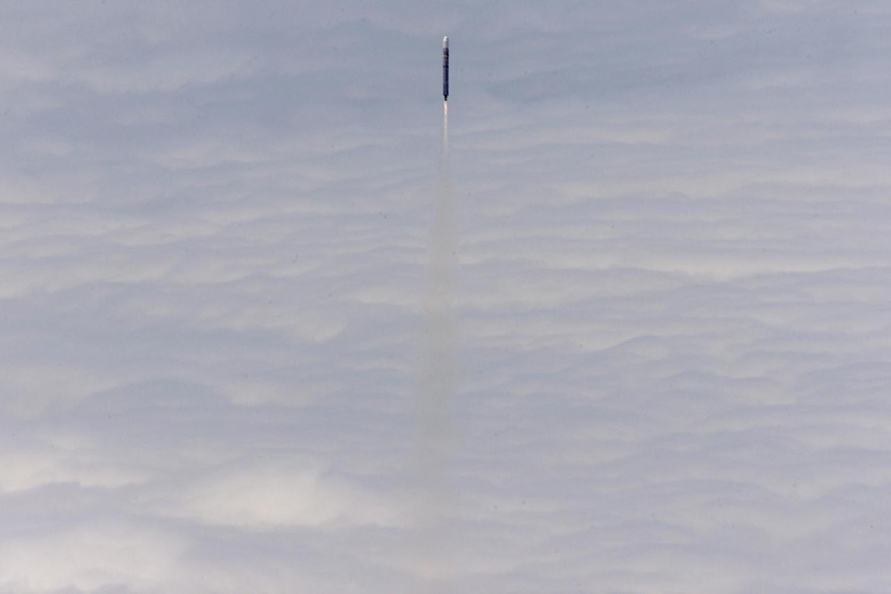 VANDENBERG AIR FORCE BASE, CALIF. -- The National Oceanic and Atmospheric Administration (NOAA) spacecraft (NOAA-M) streaks above a cloud layer after a successful launch at 2:23 p.m. EDT aboard a Titan II rocket from Vandenberg Air Force Base, Calif. NOAA-M is another in a series of polar-orbiting Earth environmental observation satellites that provide global data to NOAA's short- and long-range weather forecasting systems