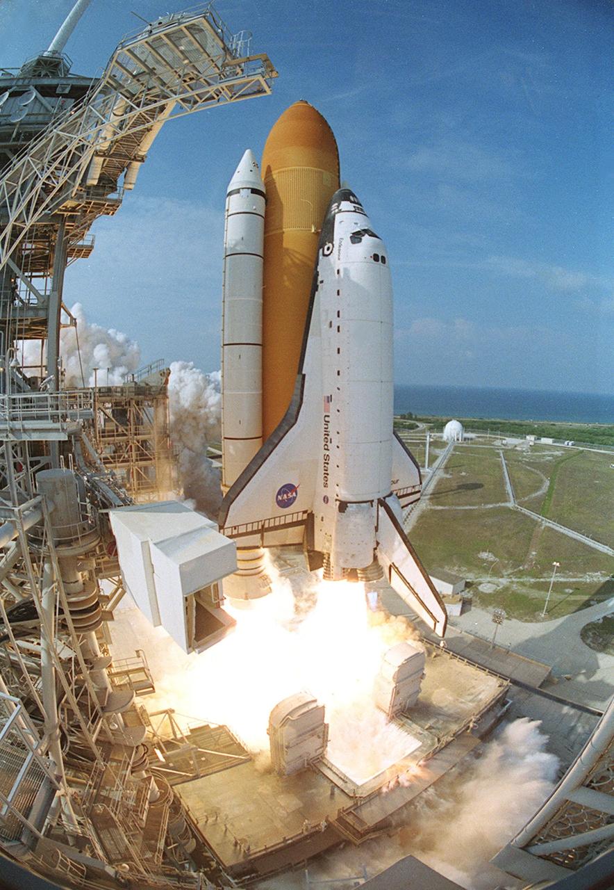 KENNEDY SPACE CENTER, FLA. -- A fish-eye view captures Space Shuttle Endeavour just after liftoff, which occurred at 5:22:49 p.m. EDT. The Shuttle and crew are bound for the International Space Station on mission STS-111, a utilization flight. This mission marks the 14th Shuttle flight to the International Space Station and the third Shuttle mission this year. Mission STS-111 is the 18th flight of Endeavour and the 110th flight overall in NASA's Space Shuttle program