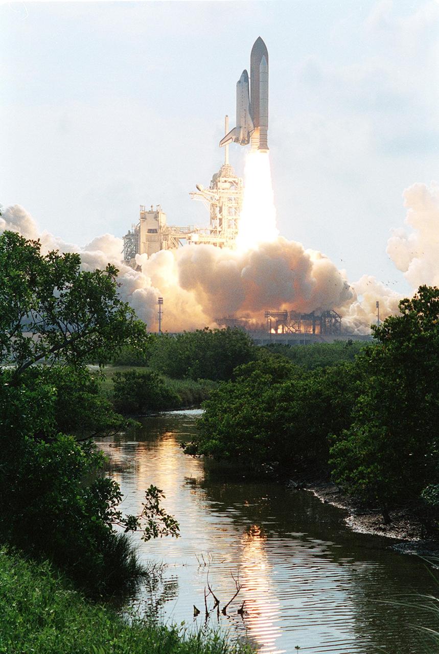 KENNEDY SPACE CENTER, FLA. -- Water near Launch Pad 39A reflects the fiery trail behind Space Shuttle Endeavour as it lifts off on mission STS-111. Liftoff occurred at 5:22:49 p.m. EDT. This mission marks the 14th Shuttle flight to the International Space Station and the third Shuttle mission this year. Mission STS-111 is the 18th flight of Endeavour and the 110th flight overall in NASA's Space Shuttle program
