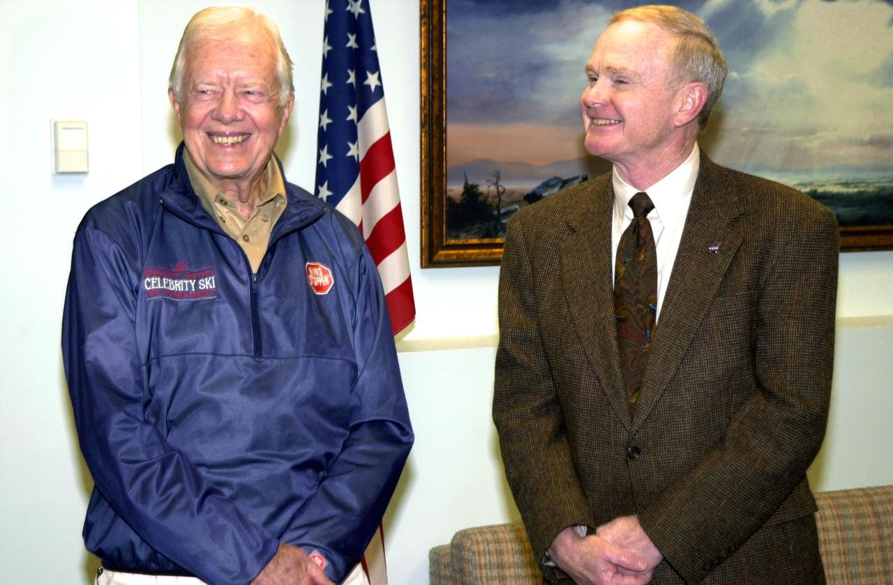 KENNEDY SPACE CENTER, FLA. -- During a visit to Kennedy Space Center, former President Jimmy Carter (left) pauses for a photo with Center Director Roy D. Bridges