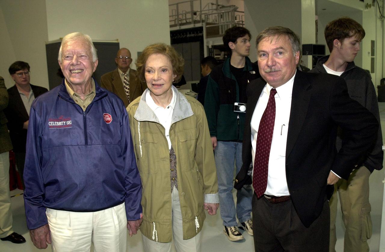 KENNEDY SPACE CENTER, FLA. -- Former President Jimmy Carter (left) and Rosalyn Carter visit the Space Station Processing Facility on their tour of Kennedy Space Center. With them (right) is Director of Payload Processing, International Space Station, Tip Talone (left of Rosalyn Carter)