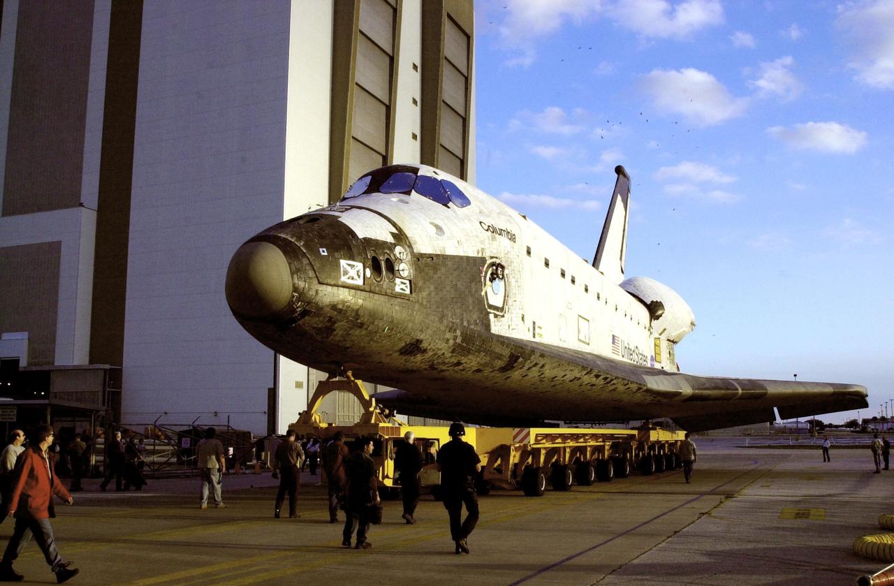 KENNEDY SPACE CENTER, FLA. --   After leaving the Orbiter Processing Facility, orbiter Columbia rolls toward the Vehicle Assembly Building where it will be mated with the external tank-solid rocket booster stack.   Columbia is scheduled to be launched Feb. 28 on mission STS-109, a Hubble Servicing Mission. The goal of the mission is to service the HST, replacing Solar Array 2 with Solar Array 3, replacing the Power Control Unit, removing the Faint Object Camera and installing the ACS, installing the Near Infrared Camera and Multi-Object Spectrometer (NICMOS) Cooling System, and installing New Outer Blanket Layer insulation