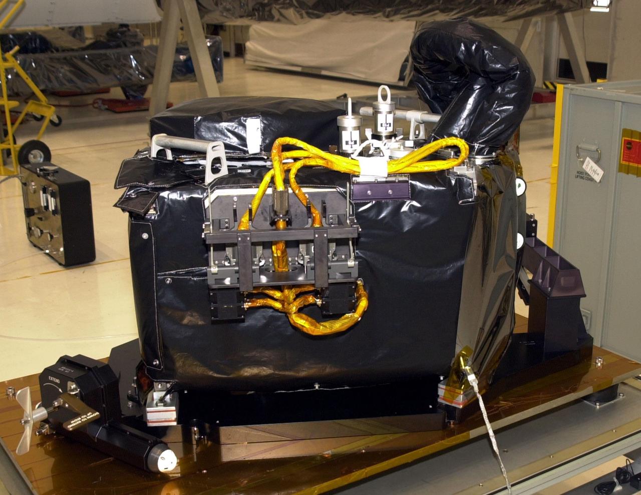 KENNEDY SPACE CENTER, FLA. -- A closeup view of the Near Infrared Camera and Multi-Object Spectrometer (NICMOS) Cooling System, part of the payload on mission STS-109, the Hubble Servicing Telescope Mission. NICMOS II is a new experimental cooling system consisting of a compressor and tiny turbines. With the experimental cryogenic system, NASA hopes to re-cool the infrared detectors to below -315 degrees F (-193 degrees Celsius). NICMOS II was previously tested aboard STS-95 in 1998. It could extend the life of the Hubble Space Telescope by several years. Astronauts aboard Columbia on mission STS-109 will be replacing the original NICMOS with the newer version. Launch of mission STS-109 is scheduled for Feb. 28, 2002