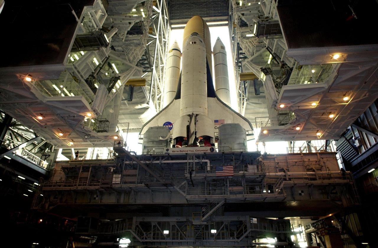 KENNEDY SPACE CENTER, FLA. -- Space Shuttle Columbia sits atop its Mobile Launcher Platform in the open doorway of the Vehicle Assembly Building. The Shuttle never left the VAB due to a steering problem on the crawler-transporter under the MLP. The problem was a faulty bearing in the steering linkage of Power Truck Drive D, which was detected before the C-T left the VAB. Rollout has been rescheduled for Jan. 24