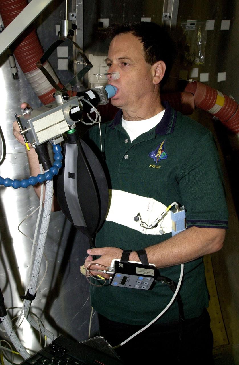 KENNEDY SPACE CENTER, FLA. - STS-107 Payload Specialist Ilan Ramon, from Israel, trains on equipment at SPACEHAB, Cape Canaveral, Fla. STS-107 is a research mission. The primary payload is the first flight of the SHI Research Double Module (SHI/RDM). The experiments range from material sciences to life sciences (many rats). Also part of the payload is the Fast Reaction Experiments Enabling Science, Technology, Applications and Research (FREESTAR) that incorporates eight high priority secondary attached shuttle experiments: Mediterranean Israeli Dust Experiment (MEIDEX), Shuttle Ozone Limb Sounding Experiment (SOLSE-2), Student Tracked Atmospheric Research Satellite for Heuristic International Networking Experiment (STARSHINE), Critical Viscosity of Xenon-2 (CVX-2), Solar Constant Experiment-3 (SOLOCON-3), Prototype Synchrotron Radiation Detector (PSRD), Low Power Transceiver (LPT), and Collisions Into Dust Experiment -2 (COLLIDE-2). STS-107 is scheduled to launch in July 2002