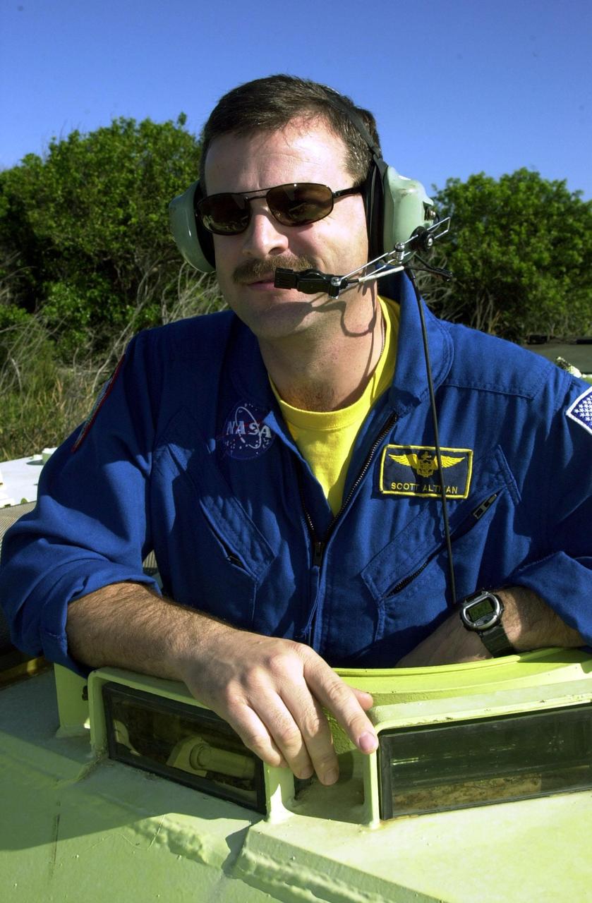 KENNEDY SPACE CENTER, FLA. -- STS-109 Commander Scott Altman is ready to practice driving the M-113 armored personnel carrier, part of emergency egress training at the launch pad. He and other crew members are taking part in Terminal Countdown Demonstration Test activities, which also include a simulated launch countdown. STS-109 is a Hubble Space Telescope Servicing Mission, with goals to replace Solar Array 2 with Solar Array 3, replace the Power Control Unit, remove the Faint Object Camera and install the Advanced Camera for Surveys (ACS), install the Near Infrared Camera and Multi-Object Spectrometer (NICMOS) Cooling System, and install New Outer Blanket Layer insulation. The 11-day mission will require grasping the satellite with a robotic arm in order for the crew to perform the tasks during five spacewalks. Launch of STS-109 aboard Space Shuttle Columbia is scheduled for Feb. 28, 2002