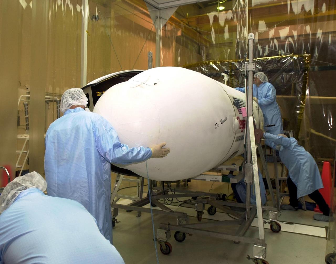 VANDENBERG AFB, CALIF. -- Technicians ready the Pegasus XL rocket, the vehicle that will launch the High Energy Solar Spectroscopic Imager (HESSI), for flight to Florida. The primary mission of HESSI is to explore the basic physics of particle acceleration and energy release in solar flares. The launch of PegasusXL/HESSI is scheduled for Feb. 5, 2002, from beneath an Orbital Sciences Corp. L-1011 aircraft over the Atlantic Ocean