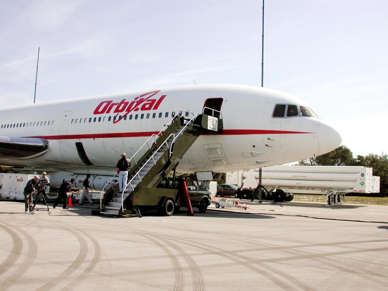 KENNEDY SPACE CENTER, FLA. -- Orbital Sciences Corp.'s L-1011 aircraft is on display for a press showing at Cape Canaveral Air Force Station, Fla. Underneath is the Pegasus XL rocket, the vehicle that will launch the High Energy Solar Spectroscopic Imager (HESSI). The primary mission of HESSI is to explore the basic physics of particle acceleration and energy release in solar flares. The launch of PegasusXL/HESSI is scheduled for Feb. 5, 2002