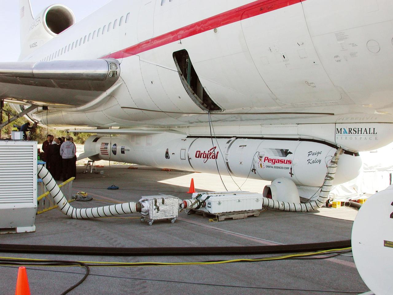 KENNEDY SPACE CENTER, FLA. - Underneath the belly of Orbital Sciences Corp.'s L-1011 aircraft is the Pegasus XL rocket, the vehicle that will launch the High Energy Solar Spectroscopic Imager (HESSI), on display at Cape Canaveral Air Force Station, Fla. The primary mission of HESSI is to explore the basic physics of particle acceleration and energy release in solar flares. The launch of PegasusXL/HESSI is scheduled for Feb. 5, 2002