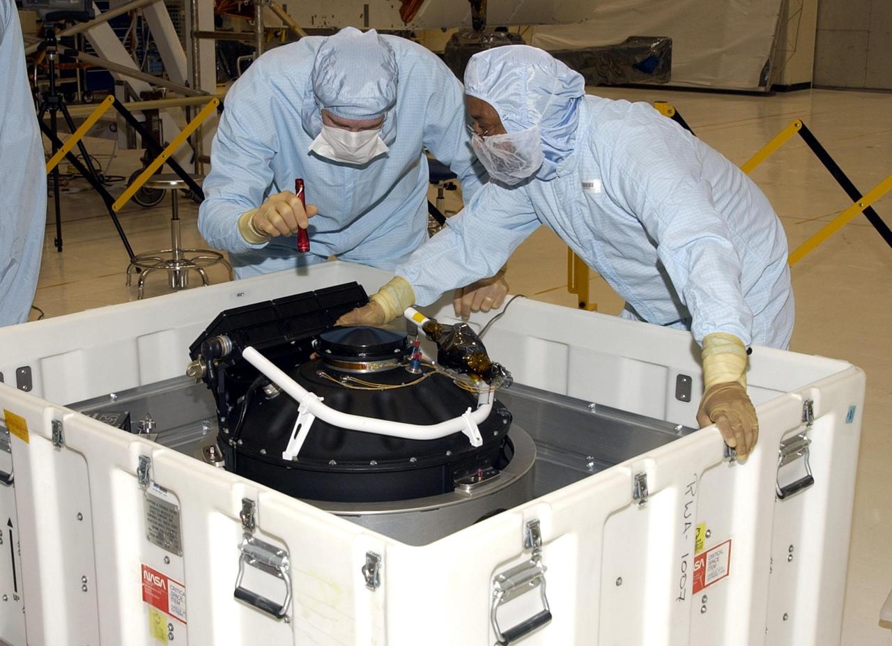 KENNEDY SPACE CENTER, FLA. -- The replacement Reaction Wheel Actuator for the Hubble Space Telescope arrives at the Vertical Processing Facility. Part of Hubble's Pointing Control System, the actuators receiving information from sensors and physically adjust Hubble's position and orientation so that Hubble can view the required celestial bodies. The reaction wheels work by rotating a large flywheel up to 3000 rpm or braking it to exchange momentum with the spacecraft which will make Hubble turn. The RWA is part of the payload on mission STS-109, the Hubble Servicing Mission, scheduled to launch Feb. 28, 2002