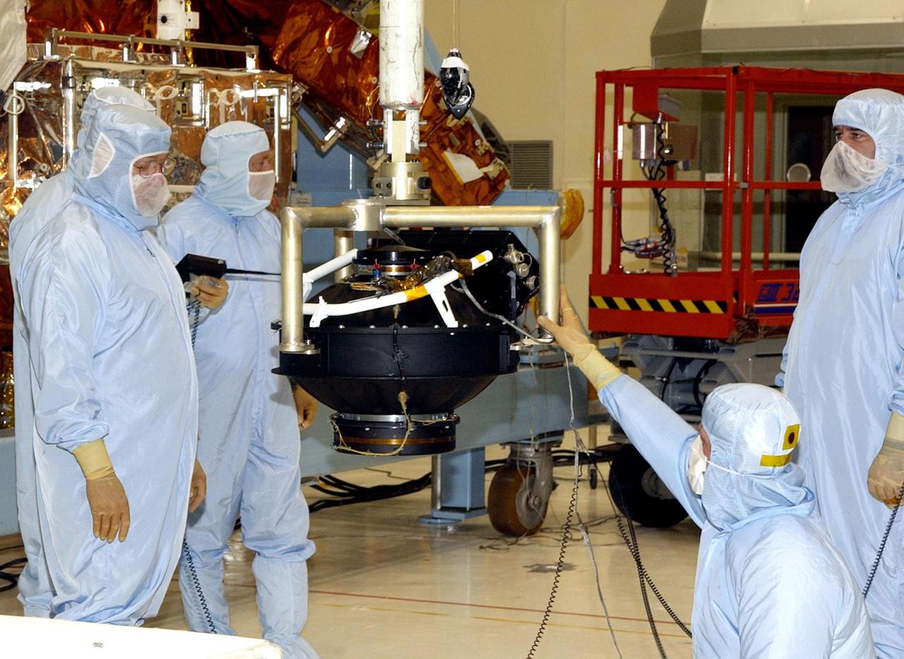 KENNEDY SPACE CENTER, FLA. - In the Vertical Processing Facility, the replacement Reaction Wheel Actuator for the Hubble Space Telescope is moved from its shipping container. Part of Hubble's Pointing Control System, the actuators receiving information from sensors and physically adjust Hubble's position and orientation so that Hubble can view the required celestial bodies. The reaction wheels work by rotating a large flywheel up to 3000 rpm or braking it to exchange momentum with the spacecraft which will make Hubble turn. The RWA is part of the payload on mission STS-109, the Hubble Servicing Mission, scheduled to launch Feb. 28, 2002