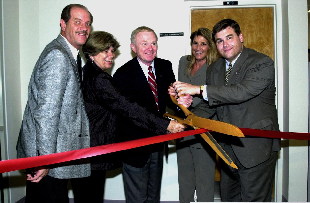 KENNEDY SPACE CENTER, FLA. --   Center Director Roy Bridges Jr. (center) cuts the ribbon for the opening of KSC Direct, the new Web-Broadcast Studio at KSC.  Joining him are (left to right) Dennis Armstrong, Web Multimedia manager; JoAnn H. Morgan, director of External Relations and Business Development; Bridges; Vanessa Stromer, Information Technology Division, Spaceport Services; and Brian Chase, district director for Congressman Dave Weldon, who was unable to attend the ceremony.   Located in the News Center on the Press Mound at KSC, the Web Broadcast Studio provides video clips of launches, landings and other KSC events in a real-time environment, called KSC Direct, through KSC's Web pages