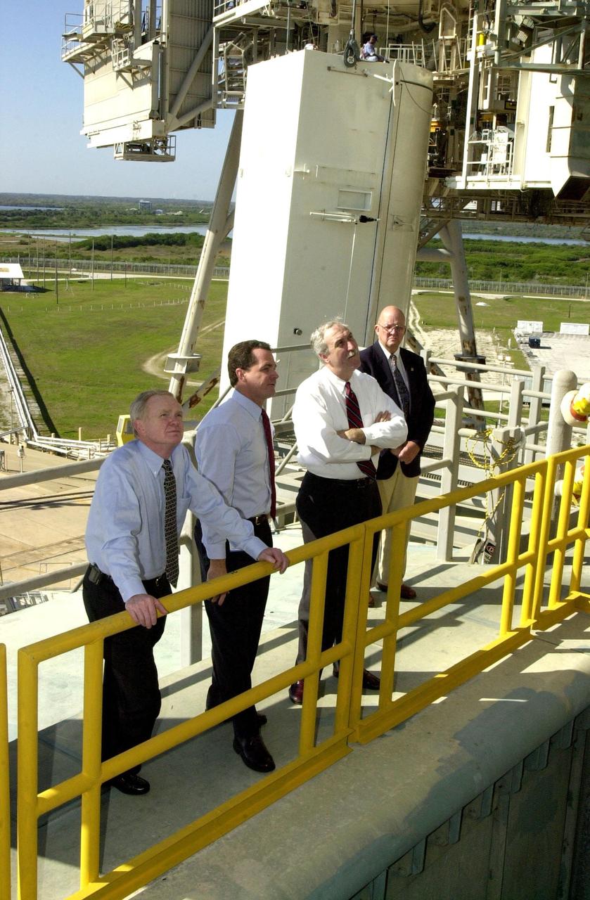KENNEDY SPACE CENTER, Fla. - At Launch Pad 39A, (from left) Center Director Roy Bridges Jr., Shuttle Processing Director Dave King and the new NASA Administrator Sean O'Keefe look over Space Shuttle Columbia, scheduled to launch Feb. 28 on mission STS-109.  The administrator was at KSC on an agencywide familiarization tour of NASA field centers.  He was nominated for the position as administrator in November 2001 by President George W. Bush.  He was sworn in Dec. 21 as the agency's 10th chief