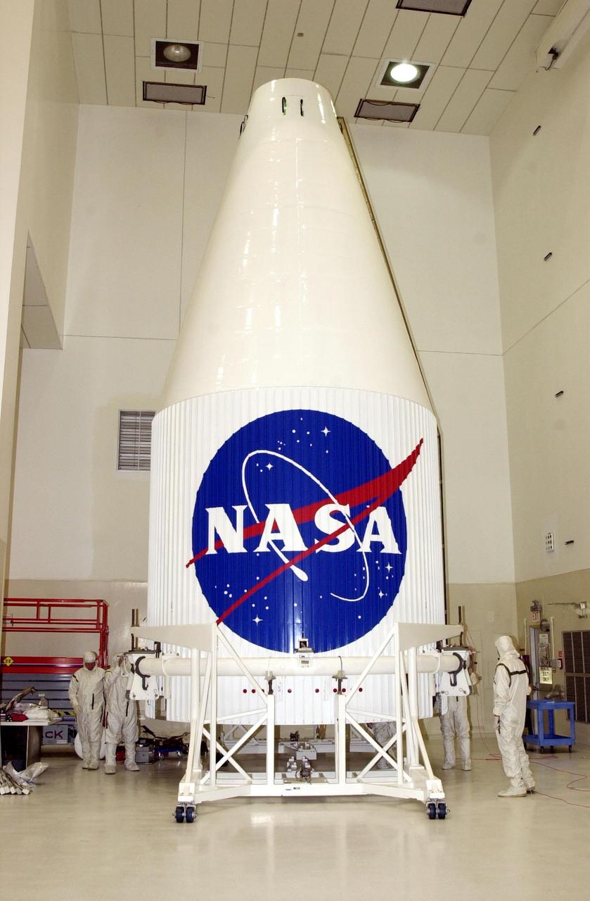 KENNEDY SPACE CENTER, Fla. - The nose fairing for the Tracking and Data Relay Satellite-I (TDRS-I) rests on a workstand in the Spacecraft Assembly and Encapsulation Facility-2 (SAEF-2) where the satellite is being prepared for launch. The second in a new series of telemetry satellites, TDRS-I replenishes the existing on-orbit fleet of six spacecraft. The TDRS System is the primary source of space-to-ground voice, data and telemetry for the Space Shuttle. It also provides communications with the International Space Station and scientific spacecraft in low-Earth orbit such as the Hubble Space Telescope. This new advanced series of satellites will extend the availability of TDRS communications services until about 2017. Launch of TDRS-I is scheduled for March 8 aboard a Lockheed Martin Atlas IIA rocket from Pad 36-A, Cape Canaveral Air Force Station