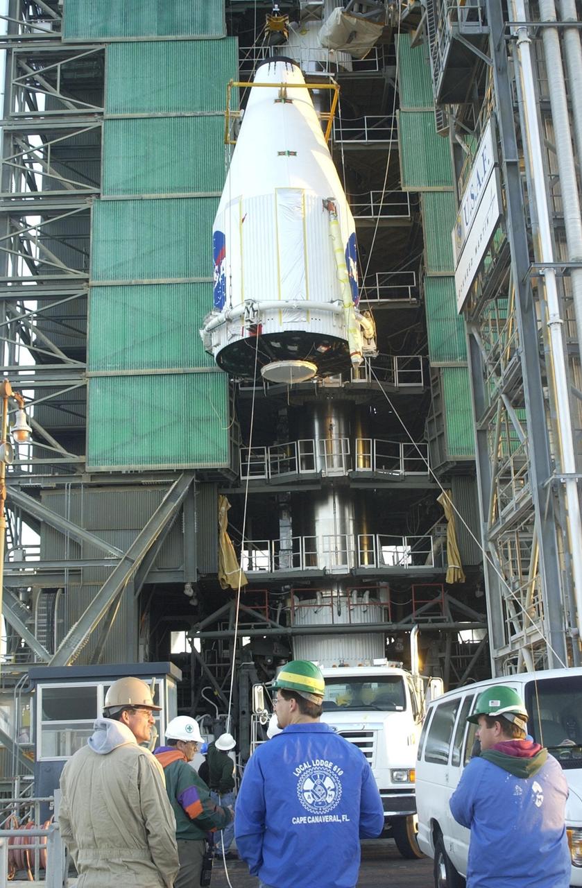 KENNEDY SPACE CENTER, FLA. --  The nose fairing arrives at Pad 36-A, Cape Canaveral Air Force Station, Fla., with the Tracking and Data Relay Satellite-I (TDRS-I) inside.  The fairing will be attached to the Lockheed Martin Atlas IIA rocket for launch. The second in a new series of telemetry satellites, TDRS-I replenishes the existing on-orbit fleet of six spacecraft. The TDRS System is the primary source of space-to-ground voice, data and telemetry for the Space Shuttle. It also provides communications with the International Space Station and scientific spacecraft in low-Earth orbit such as the Hubble Space Telescope. This new advanced series of satellites will extend the availability of TDRS communications services until about 2017. Launch of TDRS-I is scheduled for March 8 between 5:39 - 6:19 p.m. EST
