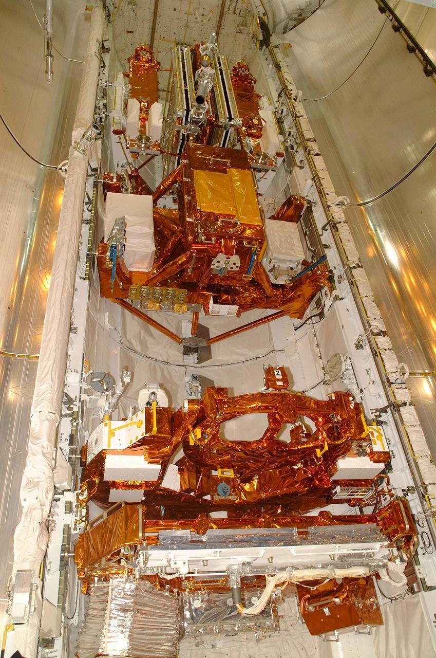 KENNEDY SPACE CENTER, FLA. --  All of the payload elements on mission STS-109 are installed in Columbia's payload bay: Solar Array 3, a new Power Control Unit, the Advanced Camera for Surveys (ACS), Near Infrared Camera, Multi-Object Spectrometer (NICMOS) Cooling System, and New Outer Blanket Layer insulation. Four mission specialists will perform five scheduled spacewalks to complete system upgrades to the telescope with these components. The STS-109 crew includes Commander Scott D. Altman, Pilot Duane G. Carey, and Mission Specialists John M. Grunsfeld, Nancy J. Currie, James H. Newman, Richard M. Linnehan and Michael J. Massimino.  Launch is scheduled for Feb. 28, 2002, at 6:48 a.m. EST (11:48 GMT).  Photo by Carl Winebarger