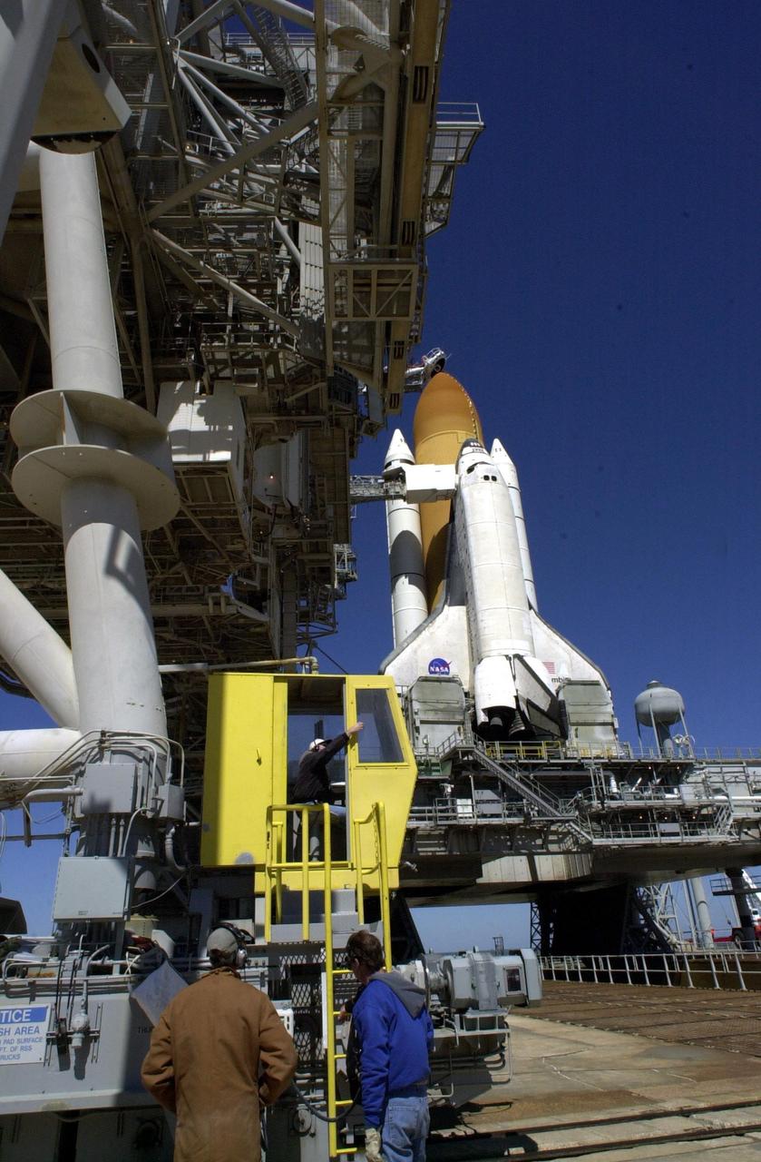 KENNEDY SPACE CENTER, FLA. - The Rotating Service Structure is rolled back from Space Shuttle Columbia in preparation for launch Feb. 28, 2002, at 6:48 a.m. EST (11:48 GMT) on mission STS-109. A Hubble Servicing Mission, the goal is to replace Solar Array 2 with Solar Array 3, replace the Power Control Unit, remove the Faint Object Camera and install the ACS, install the Near Infrared Camera and Multi-Object Spectrometer (NICMOS) Cooling System, and install New Outer Blanket Layer insulation.