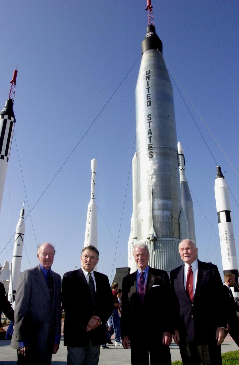 KENNEDY SPACE CENTER, FLA. --  Four space pioneers pose for a photo in the Rocket Garden at the KSC Visitor Complex.  From left are Gordon Cooper, Wally Schirra, Scott Carpenter and John Glenn Jr.  The occasion was the celebration of the 40th anniversary of American spaceflight.  The event was held Feb. 24, 2002