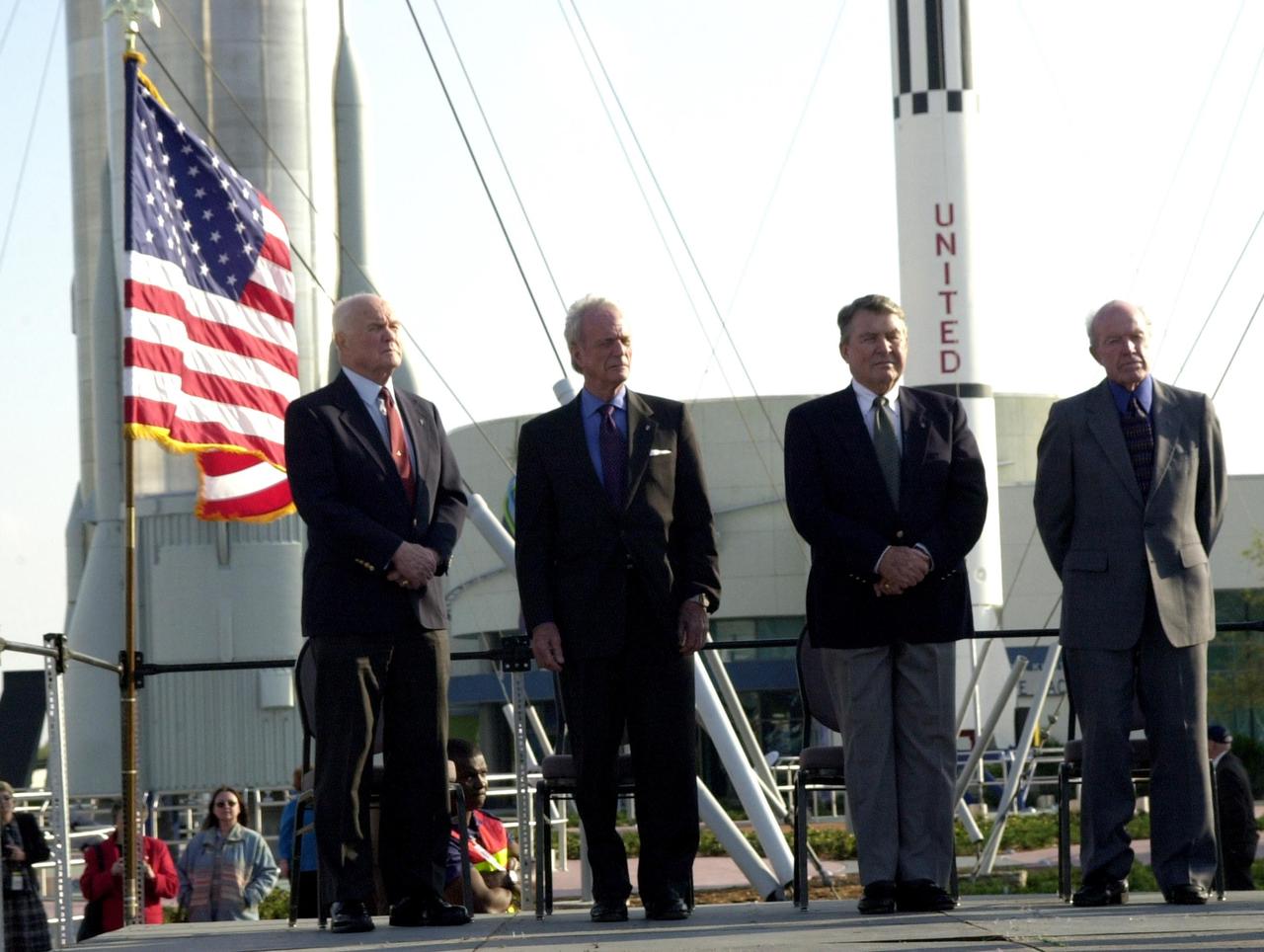 KENNEDY SPACE CENTER, FLA. --  During opening ceremonies for the 40th anniversary celebration of American spaceflight, four space pioneers stand at attention: (from left) John Glenn Jr., Scott Carpenter, Wallly Schirra and Gordon Cooper.  The site is the Rocket Garden in the KSC Visitor Complex
