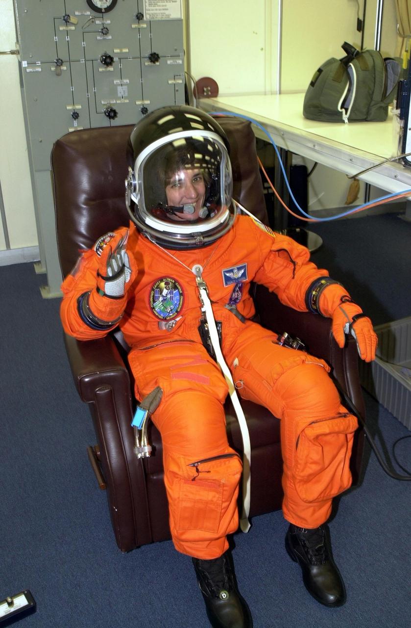 KENNEDY SPACE CENTER, Fla. -  STS-109 Mission Specialist Nancy Jane Currie is ready for launch after suiting up.  Liftoff is scheduled for 6:22 a.m. EST March 1.  On mission STS-109, the crew will capture the Hubble Space Telescope using the Shuttle's robotic arm and secure it on a workstand in Columbia's payload bay.  Currie will be the primary arm operator.  Four mission specialists will perform five scheduled spacewalks to complete system upgrades to the telescope. More durable solar arrays, a large gyroscopic assembly to help point the telescope properly, a new telescope power control unit, and a cooling system to restore the use of a key infrared camera and spectrometer unit, which has been dormant since 1999, will all be installed. In addition, the telescope's view of the Universe will be improved with the addition of the Advanced Camera for Surveys (ACS), which replaces the Faint Object Camera, the last of Hubble's original instruments. Mission STS-109 is the 27th flight of the orbiter Columbia and the 108th flight overall in NASA's Space Shuttle program. After the 11-day mission, Columbia is scheduled to land about 4:35 a.m. EST March 12