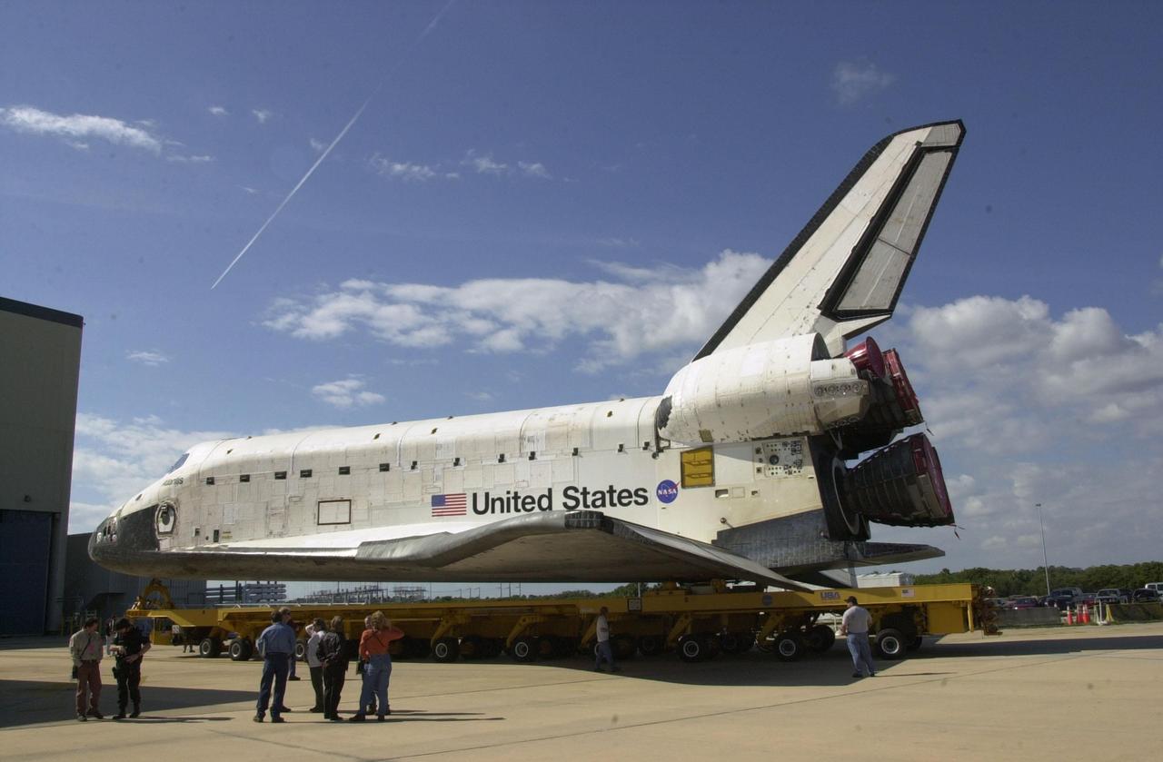 KENNEDY SPACE CENTER, FLA. --   Orbiter Atlantis rolls out of the Orbiter Processing Facility on its way to the Vehicle Assembly Building for space vehicle mate.  As part of final preparations before transfer to the launch pad, Atlantis will be lifted vertically into its VAB high bay and mated to the twin solid rocket boosters and external tank.  The STS-110 mission resumes International Space Station assembly operations with the delivery of the S0 truss, which will support solar panels providing additional power to the Station.  The payload will also include the first part of a Mobile Transporter that will provide a moveable base for the Station’s Canadian robotic arm.  STS-110 is scheduled for launch April 4