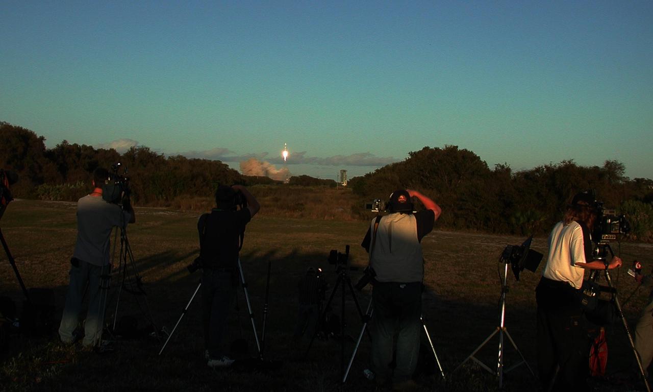 KENNEDY SPACE CENTER, FLA. --  Photographers capture the launch of the Tracking and Data Relay Satellite-I (TDRS-I) aboard a Lockheed Martin Atlas IIA rocket from Launch Pad 36-A, Cape Canaveral Air Force Station. TDRS-I replenishes the existing on-orbit fleet of six spacecraft. The TDRS System is the primary source of space-to-ground voice, data and telemetry for the Space Shuttle. It also provides communications with the International Space Station and scientific spacecraft in low-Earth orbit such as the Hubble Space Telescope. This new advanced series of satellites will extend the availability of TDRS communications services until about 2017. Liftoff occurred at 5:59 p.m. EST