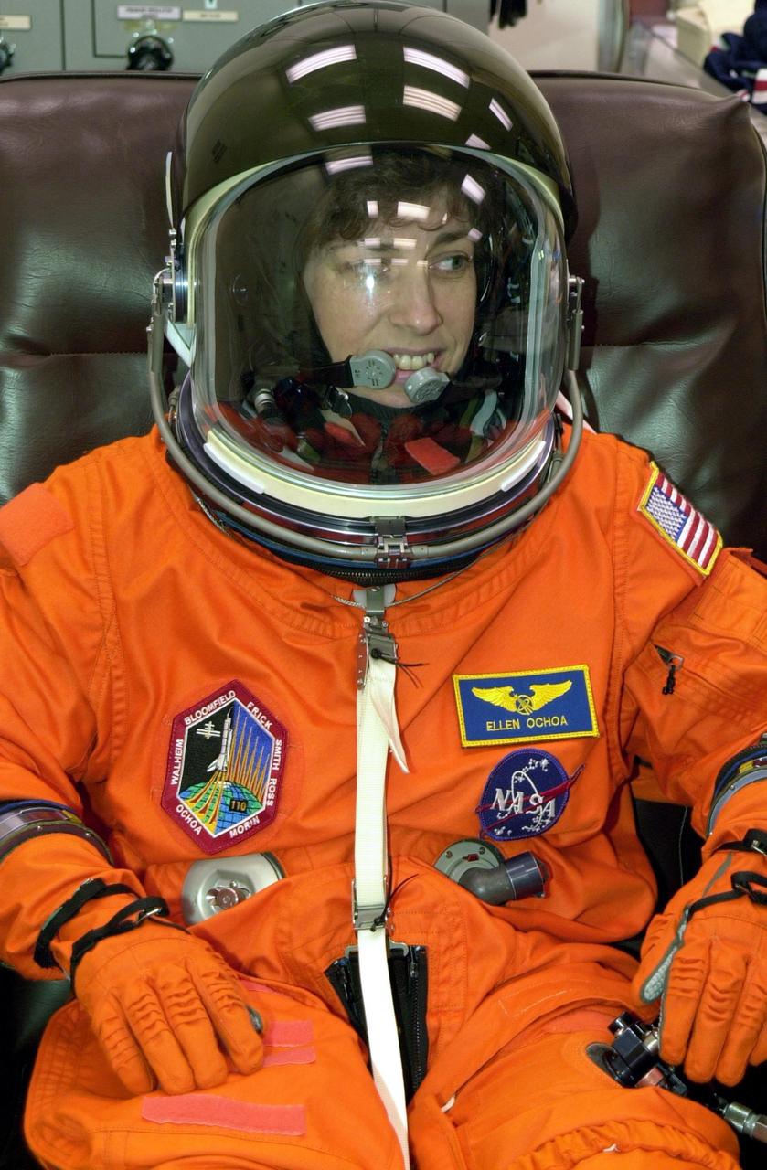 KENNEDY SPACE CENTER, FLA. - STS-110 Mission Specialist Ellen Ochoa relaxes during suit fit, part of Terminal Countdown Demonstration Test activities. The TCDT is held at KSC prior to each Space Shuttle flight to provide flight crews an opportunity to participate in simulated launch countdown activities. Scheduled for launch April 4, the 11-day mission will feature Shuttle Atlantis docking with the International Space Station (ISS) and delivering the S0 truss, the centerpiece-segment of the primary truss structure that will eventually extend over 300 feet. 