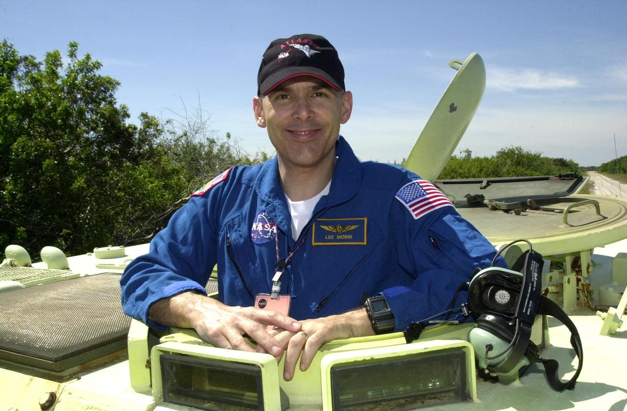 KENNEDY SPACE CENTER, FLA. -- Waiting his turn at driving the M-113 armored personnel carrier is STS-110 Mission Specialist Lee Morin. The driving is part of Terminal Countdown Demonstration Test activities, which include emergency egress training and a simulated launch countdown. The TCDT is held at KSC prior to each Space Shuttle flight.  Scheduled for launch April 4, the 11-day mission will feature Shuttle Atlantis docking with the International Space Station (ISS) and delivering the S0 truss, the centerpiece-segment of the primary truss structure that will eventually extend over 300 feet