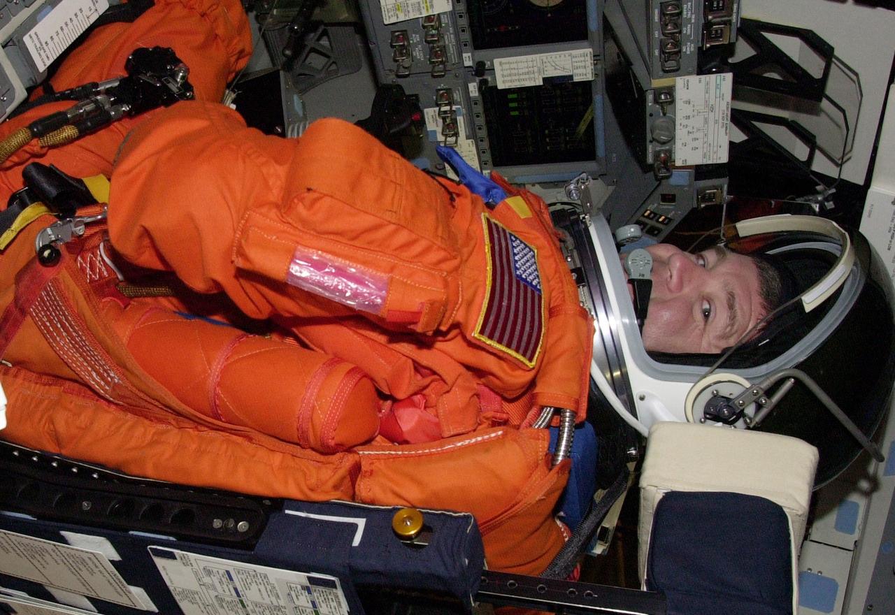 KENNEDY SPACE CENTER, FLA. --  STS-110 Pilot Stephen Frick is seated in Space Shuttle Atlantis in order to take part in a simulated launch countdown. The simulation is part of Terminal Countdown Demonstration Test activities.  TCDT also includes emergency egress training and is held at KSC prior to each Space Shuttle flight.  Scheduled for launch April 4, the 11-day mission will feature Shuttle Atlantis docking with the International Space Station (ISS) and delivering the S0 truss, the centerpiece-segment of the primary truss structure that will eventually extend over 300 feet