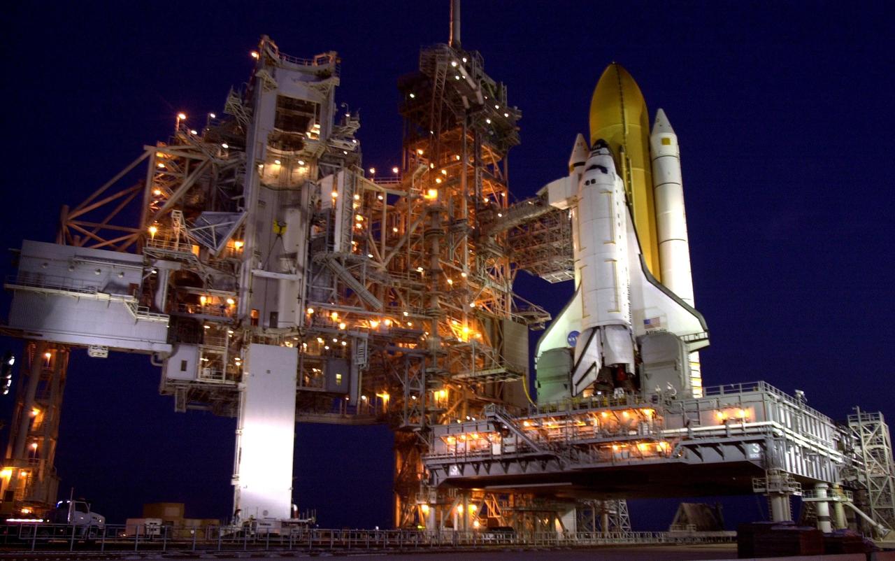 KENNEDY SPACE CENTER, FLA. --  The payload canister with the S0 Integrated Truss Structure arrives at the launch pad for transfer to Space Shuttle Atlantis's payload bay. Part of the payload on mission STS-110, the S0 truss will become the backbone of the orbiting International Space Station (ISS).     The S0 truss will be attached to the U.S. Lab, "Destiny,"  on the 11-day mission.    Launch is scheduled for April 4