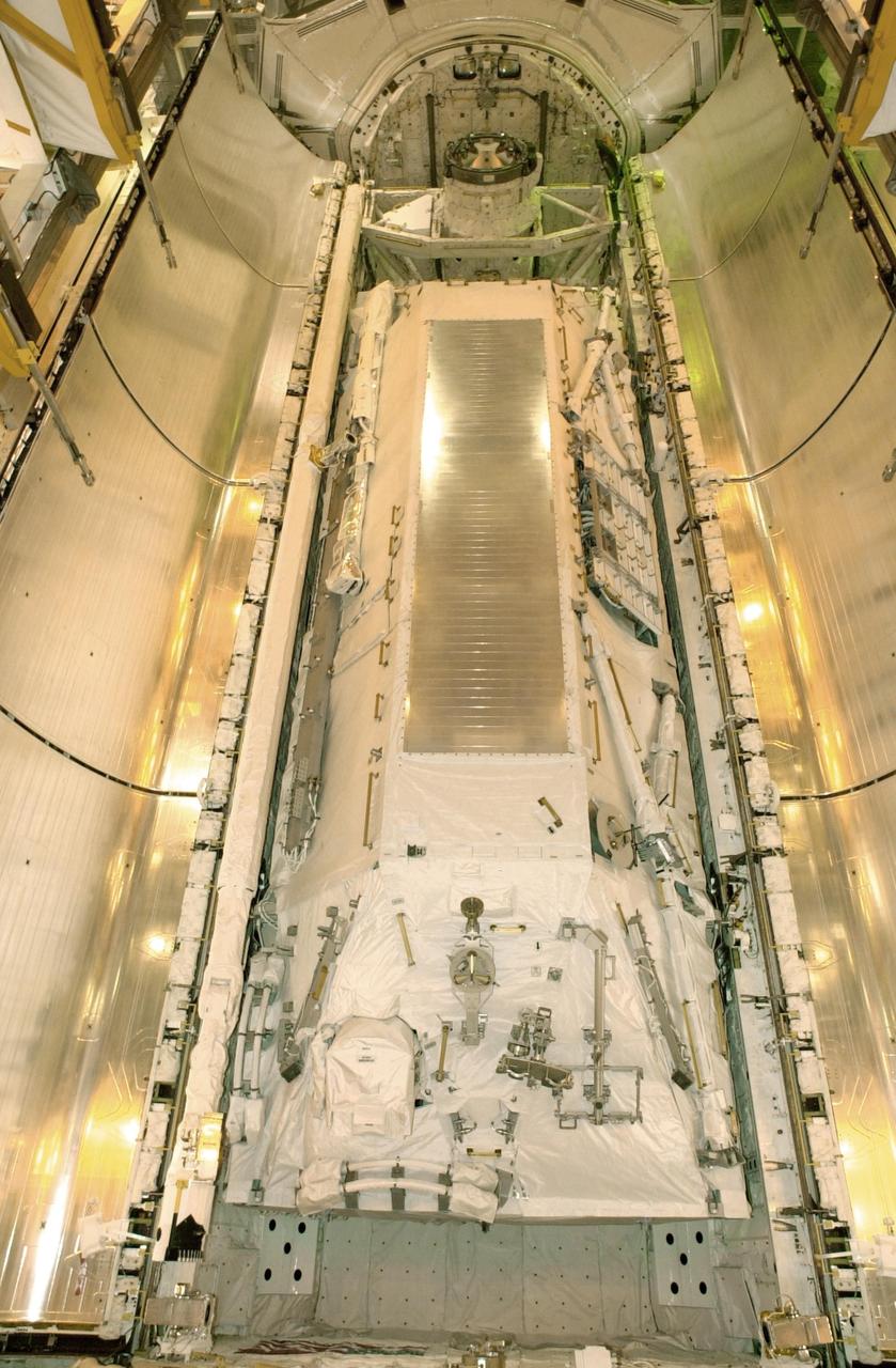 KENNEDY SPACE CENTER, FLA. --  At Launch Pad 39B, Space Shuttle Atlantis' payload bay doors are ready to be closed.  The Shuttle payload includes the S0 Integrated Truss Structure (ITS), the Canadian Mobile Transporter, power distribution system modules, a heat pipe radiator for cooling, computers and a pair of rate gyroscopes.  The mission is the 13th assembly flight to the ISS and includes four spacewalks to attach the S0 truss to the U.S. Lab Destiny.  Launch is scheduled for April 4. 