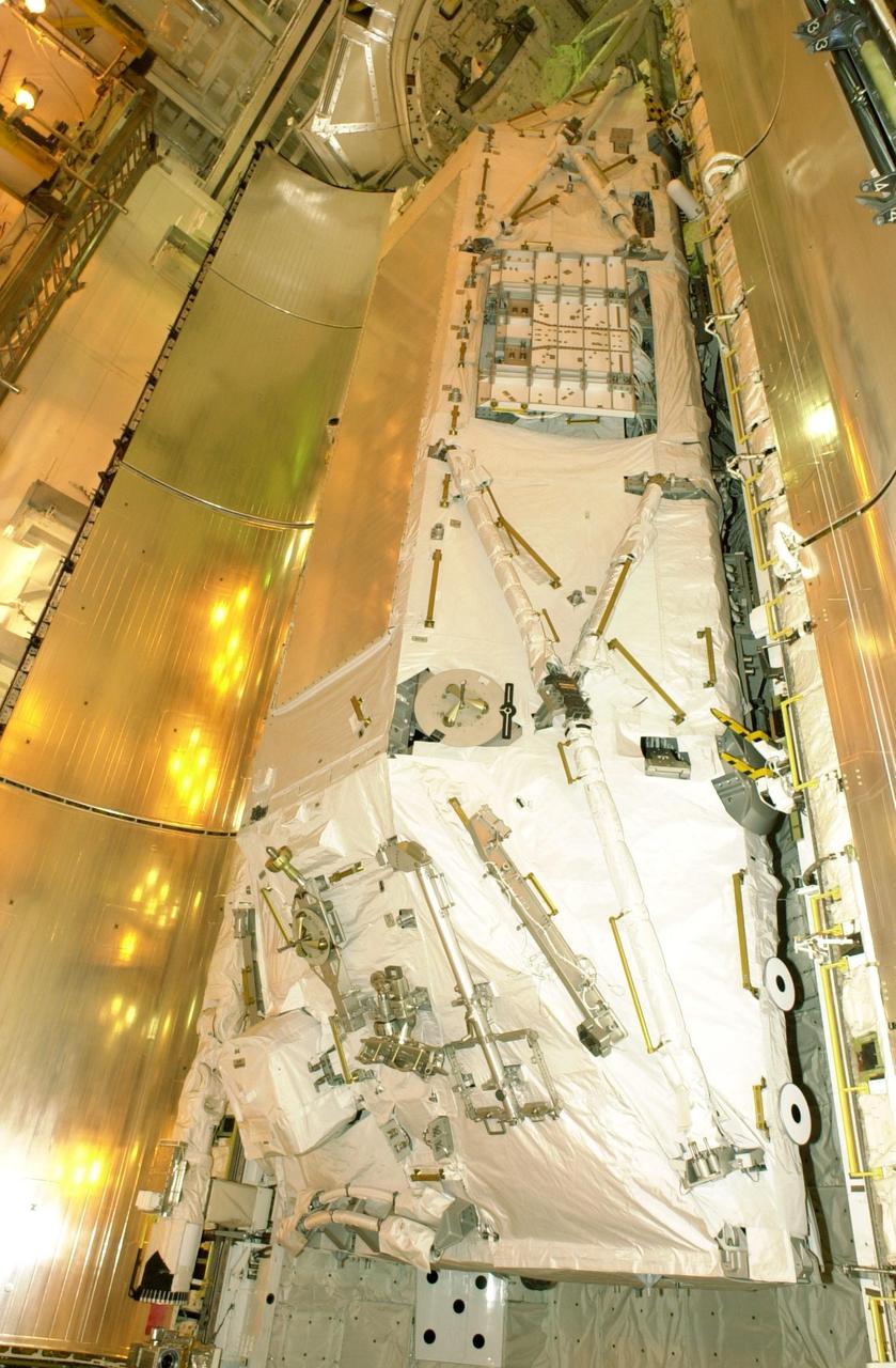 KENNEDY SPACE CENTER, FLA. -- At Launch Pad 39B, Space Shuttle Atlantis' payload bay doors are ready to be closed.  The Shuttle payload includes the S0 Integrated Truss Structure (ITS), the Canadian Mobile Transporter, power distribution system modules, a heat pipe radiator for cooling, computers and a pair of rate gyroscopes.  The mission is the 13th assembly flight to the ISS and includes four spacewalks to attach the S0 truss to the U.S. Lab Destiny.  Launch is scheduled for April 4. 