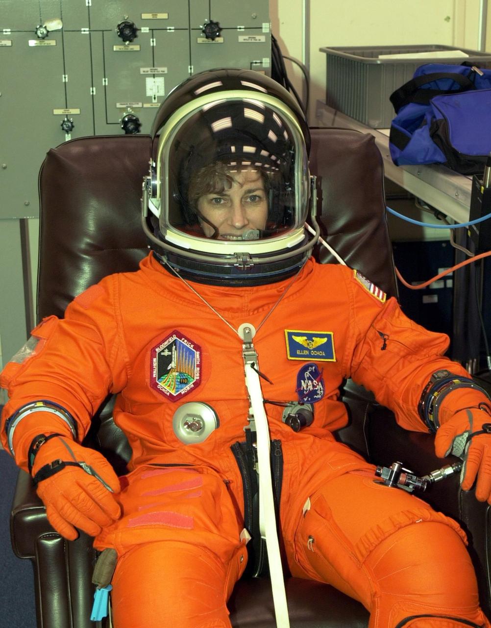 KENNEDY SPACE CENTER, FLA. --  STS-110 Mission Specialist Ellen Ochoa has a final check of her launch and entry suit in preparation for launch April 4.  This flight will be her fourth.  The STS-110 payload includes the S0 Integrated Truss Structure (ITS), the Canadian Mobile Transporter, power distribution system modules, a heat pipe radiator for cooling, computers and a pair of rate gyroscopes.  The 11-day mission is the 13th assembly flight to the ISS and includes four spacewalks to attach the S0 truss to the U.S. Lab Destiny