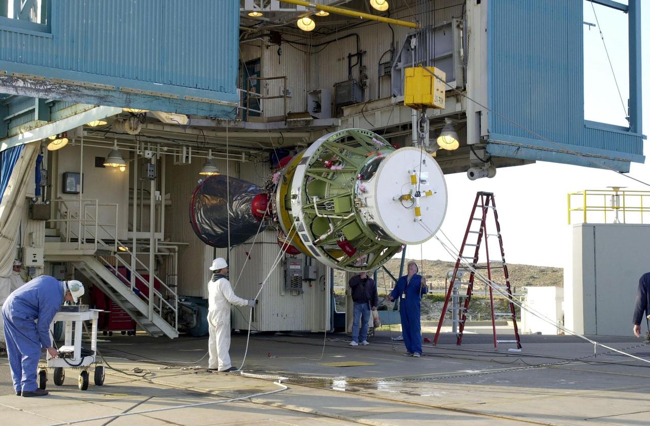 VANDENBERG AFB, CALIF. --  The second stage of the Delta II rocket is ready to be raised to vertical for its lift up the gantry on the launch pad. The Delta II rocket will launch the Aqua-EOS satellite. Aqua is one of a series of spacebased platforms that are central to NASA's Earth Science Enterprise (ESE), a long-term study of the scope, dynamics and implications of global change. The Aqua program is composed of Aqua and other spacecraft (including Terra and Aura) and a data distribution system (ESDIS, and Mission Operations Center Implementation Team).  Flying  in an orbit that covers the globe every 16 days, Aqua will provide a six-year chronology of the planet and its processes. Comprehensive measurements  taken by its onboard instruments will allow multidisciplinary teams of scientists and researchers from North and South  America, Asia, Australia and Europe to assess long-term  change, identify its human and natural causes and advance the development of models for long-term forecasting.  Launch is scheduled for April 26 from Vandenberg