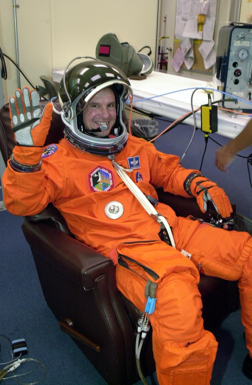 KENNEDY SPACE CENTER, FLA. --   STS-110 Commander Michael J. Bloomfield finishes suiting up before launch, scheduled for 4:40 p.m. EDT.  STS-110 is the 13th assembly flight to the International Space Station, carrying the S0 Integrated Truss Structure and Mobile Transporter (MT).  On the 11-day mission, the mission features four spacewalks to attach the S0 truss, which will become the backbone of the Space Station, to the U.S. Lab, "Destiny."   The  MT, a space "railcar," is attached to the truss segment and will make its debut run during the flight.  Bloomfield is making his third  Shuttle flight.
