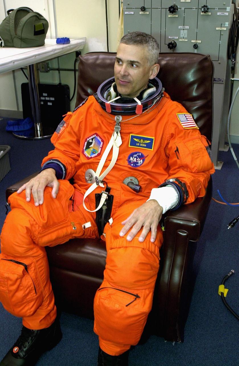 KENNEDY SPACE CENTER, FLA. --  Making his first Shuttle flight, STS-110 Mission Specialist Lee M.E. Morin waits to finish suiting up for launch, scheduled for 4:40 p.m. EDT (20:40 GMT). STS-110 is the 13th assembly flight to the International Space Station, carrying the S0 Integrated Truss Structure and Mobile Transporter (MT).  On the 11-day mission, the mission features four spacewalks to attach the S0 truss, which will become the backbone of the Space Station, to the U.S. Lab, "Destiny."   The  MT, a space "railcar," is attached to the truss segment and will make its debut run during the flight