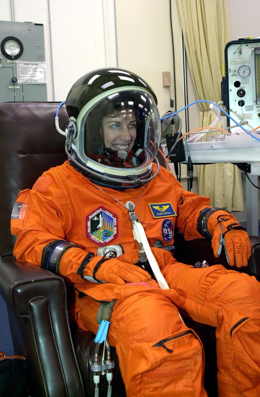 KENNEDY SPACE CENTER, FLA. --   STS-110 Mission Specialist Ellen Ochoa grins after suiting up for launch, scheduled for 4:40 p.m. EDT (20:40 GMT).   Ochoa is making her fourth Shuttle flight.  STS-110 is the 13th assembly flight to the International Space Station, carrying the S0 Integrated Truss Structure and Mobile Transporter (MT).  On the 11-day mission, the mission features four spacewalks to attach the S0 truss, which will become the backbone of the Space Station, to the U.S. Lab, "Destiny."   The  MT, a space "railcar," is attached to the truss segment and will make its debut run during the flight