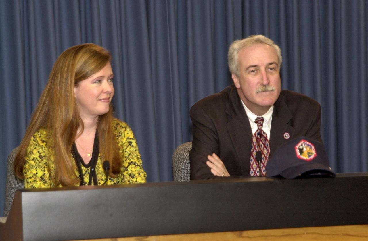 KENNEDY SPACE CENTER, FLA. --   Lisa Malone, division chief, External Affairs and Business Development, and Sean O’Keefe, NASA administrator, listen to a query from the media during a post-launch conference.  Malone moderated the conference.  O’Keefe was at KSC for the launch of Space Shuttle Atlantis on mission STS-110 to the International Space Station.  The launch occurred at 4:44:19 p.m EDT (20:44:19 GMT)
