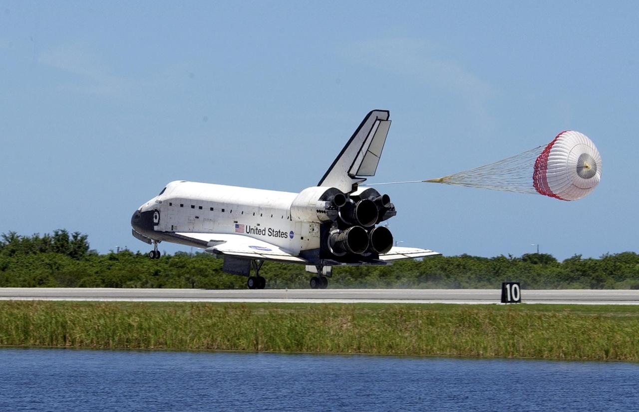 KENNEDY SPACE CENTER, FLA. -- The drag chute deploys as Atlantis touches down on runway 33 at KSC's Shuttle Landing Facility.  The landing completes the 10-day, 19-hour, 4.5-million mile mission STS-110 to the International Space Station.  The orbiter carries the returning crew Commander Michael Bloomfield, Pilot Stephen Frick and Mission Specialists Jerry Ross, Steven Smith, Ellen Ochoa, Lee Morin and Rex Walheim.  Main gear touchdown was 12:26:57 p.m. EDT, nose gear touchdown was 12:27:09 p.m. and wheel stop was 12:28:07 p.m.  The crew delivered and installed the S0 truss, which will support cooling and power systems essential for the addition of future international laboratories, on the Station