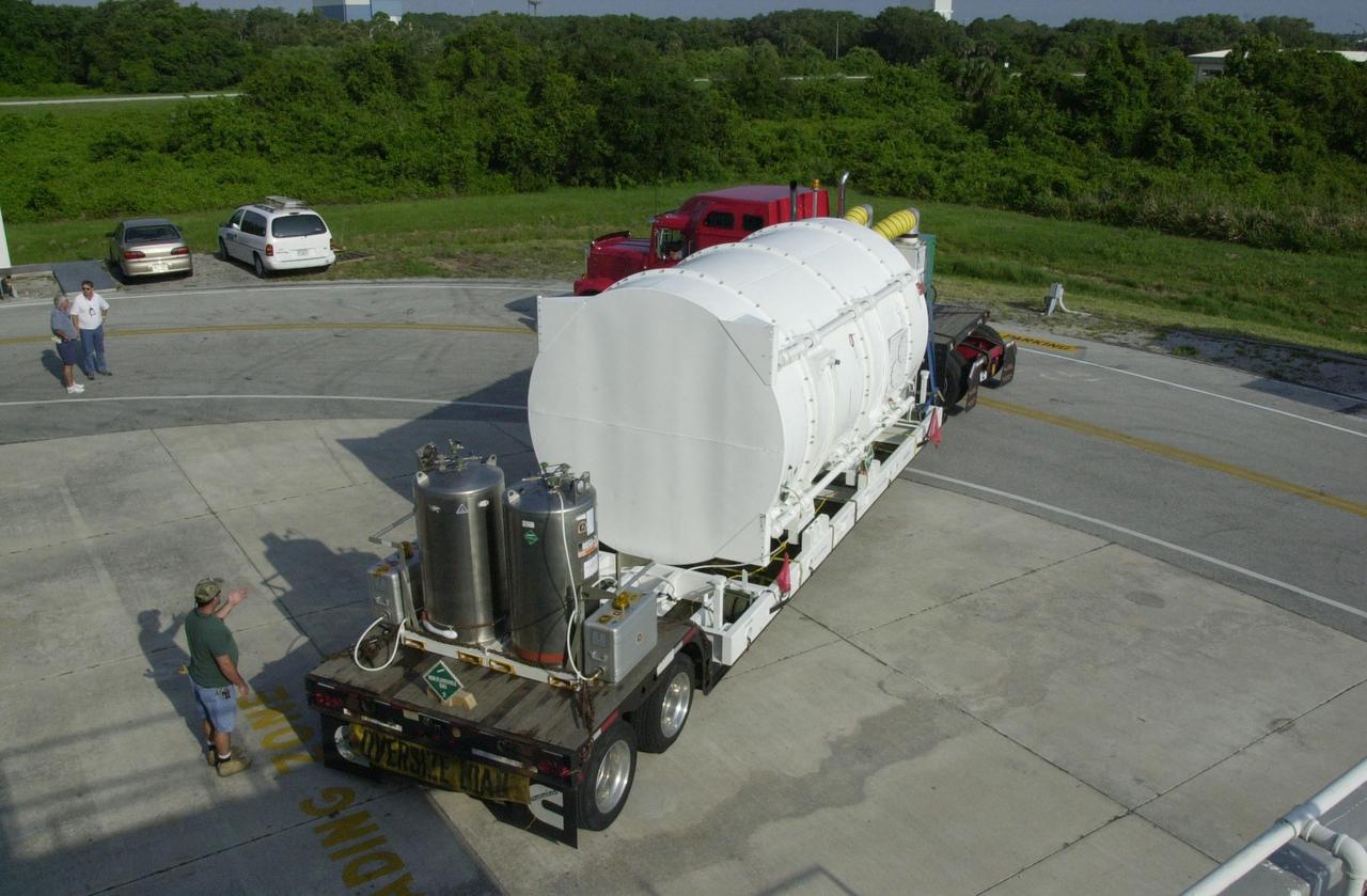 KENNEDY SPACE CENTER, FLA. -- The NASA Comet Nucleus Tour (CONTOUR) spacecraft arrived at KSC on April 24 and was transported to the Spacecraft Assembly and Encapsulation Facility-2 (SAEF-2) to begin final preparations for launch. CONTOUR will provide the first detailed look into the heart of a comet - the nucleus. The spacecraft will fly as close as 60 miles (100 kilometers) to at least two comets, Encke and Schwassmann-Wachmann 3, taking the sharpest pictures yet of the nucleus while analyzing the gas and dust that surround these rocky, icy building blocks of the solar system. The Applied Physics Laboratory of Johns Hopkins University, Baltimore, Md., built CONTOUR and will also be in control of the spacecraft after launch, scheduled for July 1, 2002, from LC 17A at Cape Canaveral Air Force Station
