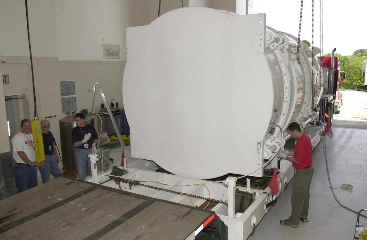 KENNEDY SPACE CENTER, FLA. -- The NASA Comet Nucleus Tour (CONTOUR) spacecraft arrived at KSC on April 24 and was transported to the Spacecraft Assembly and Encapsulation Facility-2 (SAEF-2) to begin final preparations for launch. CONTOUR will provide the first detailed look into the heart of a comet - the nucleus. The spacecraft will fly as close as 60 miles (100 kilometers) to at least two comets, Encke and Schwassmann-Wachmann 3, taking the sharpest pictures yet of the nucleus while analyzing the gas and dust that surround these rocky, icy building blocks of the solar system. The Applied Physics Laboratory of Johns Hopkins University, Baltimore, Md., built CONTOUR and will also be in control of the spacecraft after launch, scheduled for July 1, 2002, from LC 17A at Cape Canaveral Air Force Station