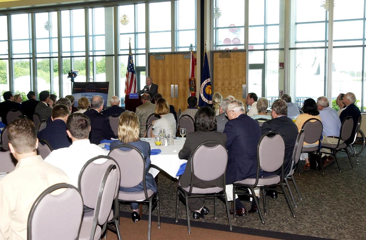 KENNEDY SPACE CENTER, FLA. -- Center Director Roy D. Bridges Jr. speaks to a large group attending the opening of a new program known as SABRE, Space Agricultural Biotechnology Research and Education, that involves the University of Florida and NASA. SABRE will focus on the discovery, development and application of the biological aspects of advanced life support strategies. The program will include faculty from UF's Institute of Food and Agricultural Sciences, who will be located at both KSC - in the state-owned Space Experiment Research and Processing Laboratory (SERPL) being built there - and UF in Gainesville. SABRE will be directed by Robert Ferl, professor in the horticultural sciences department and assistant director of UF's Biotechnology Program.  He will be responsible for coordinating the research and education efforts of UF and NASA