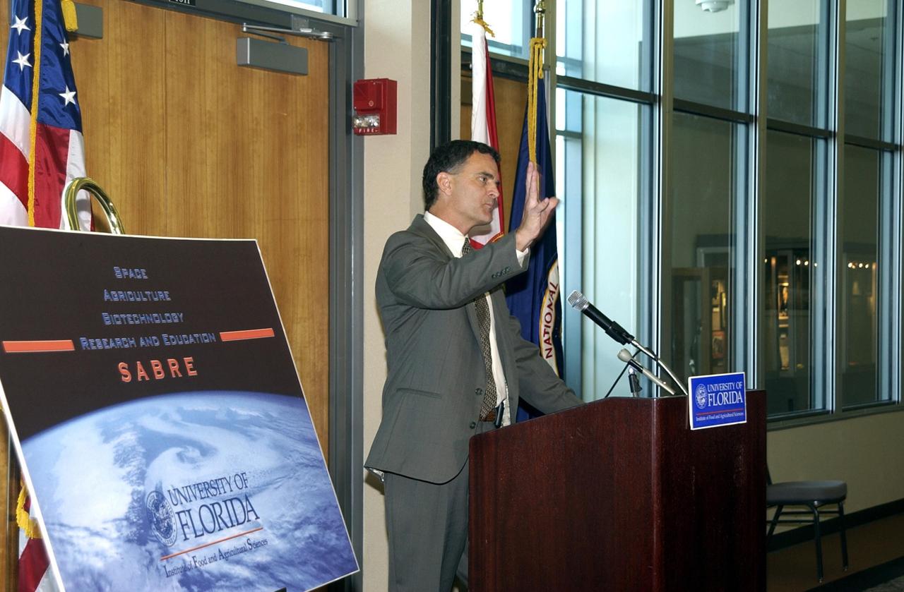 KENNEDY SPACE CENTER, FLA. -- Robert Ferl, professor in the horticultural sciences department and assistant director of the University of Florida Biotechnology Program, speaks during the opening ceremony to launch a new program called SABRE, Space Agricultural Biotechnology Research and Education, that involves UF and NASA. SABRE will focus on the discovery, development and application of the biological aspects of advanced life support strategies. The program will include faculty from UF's Institute of Food and Agricultural Sciences, who will be located at both KSC - in the state-owned Space Experiment Research and Processing Laboratory (SERPL) being built there - and UF in Gainesville. Ferl will direct and be responsible for coordinating the research and education efforts of UF and NASA.