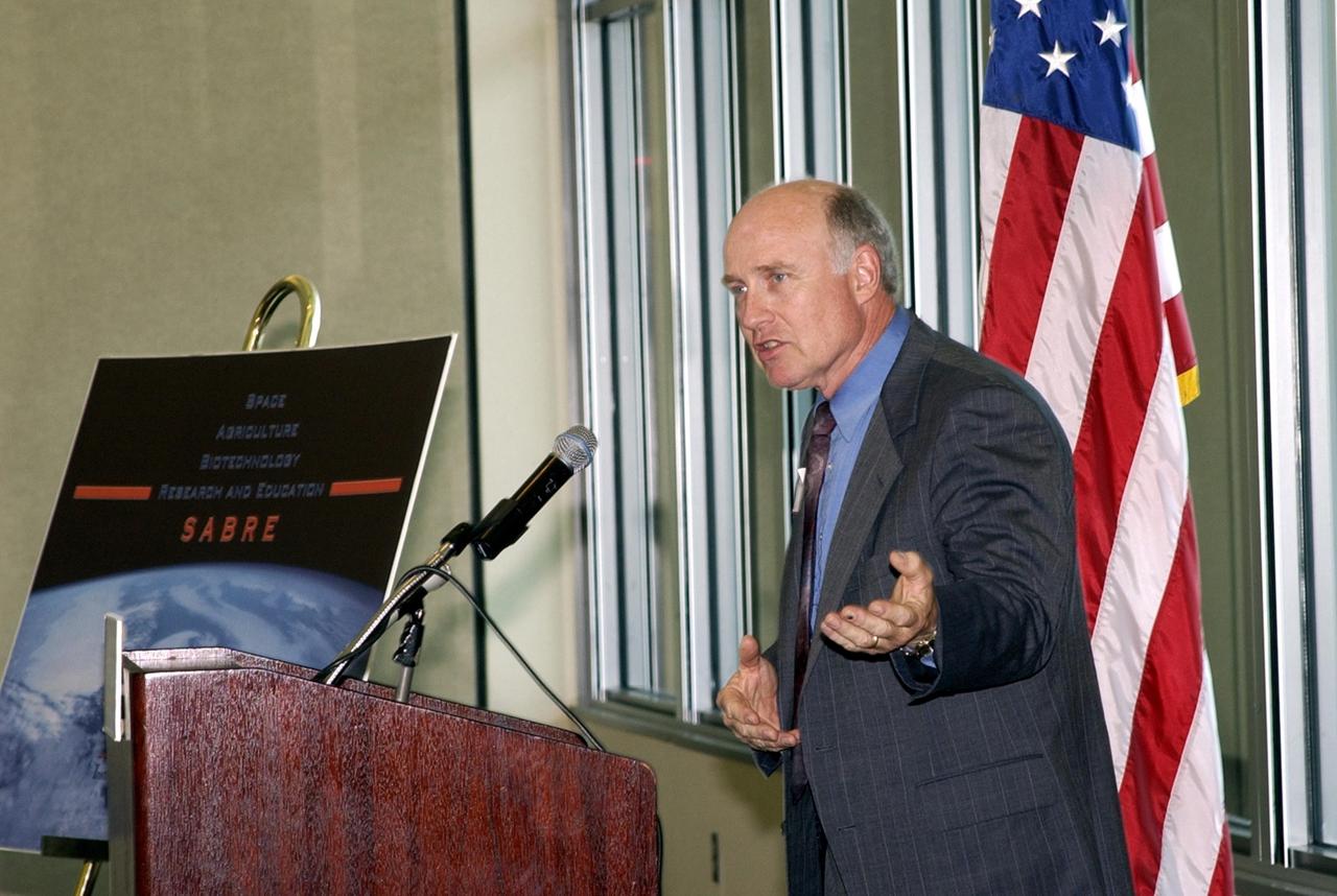 KENNEDY SPACE CENTER, FLA. -- At the opening ceremony for the new program known as SABRE, Space Agricultural Biotechnology Research and Education, William Knott speaks to attendees.  Knott is senior scientist in the NASA biological sciences office.  SABRE is a joint effort of the University of Florida and NASA and will focus on the discovery, development and application of the biological aspects of advanced life support strategies. The program will include faculty from UF's Institute of Food and Agricultural Sciences, who will be located at both KSC - in the state-owned Space Experiment Research and Processing Laboratory (SERPL) being built there - and UF in Gainesville. Robert Ferl, professor in the horticultural sciences department and assistant director of the University of Florida Biotechnology Program, will direct and be responsible for coordinating the research and education.