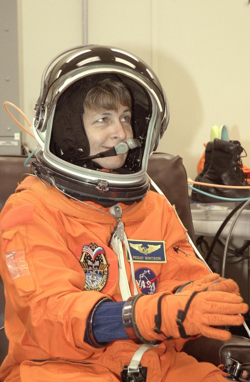 KENNEDY SPACE CENTER, FLA. - Expedition 5 crew member Peggy Whitson undergoes a suit check as part of Terminal Countdown Demonstration Test activities at KSC. The TCDT includes emergency egress training at the pad and a simulated launch countdown. Expedition 5 will travel to the International Space Station on mission STS-111 as the replacement crew for Expedition 4, who will return to Earth aboard Endeavour. Known as Utilization Flight -2, the mission includes attaching a Canadian-built mobile base system to the International Space Station that will enable the Canadarm2 robotic arm to move along a railway on the Station's truss to build and maintain the outpost. The crew will also replace a faulty wrist/roll joint on the Canadarm2 as well as unload almost three tons of experiments and supplies from the Italian-built Multi-Purpose Logistics Module Leonardo. Launch of Space Shuttle Endeavour on mission STS-111 is scheduled for May 30, 2002