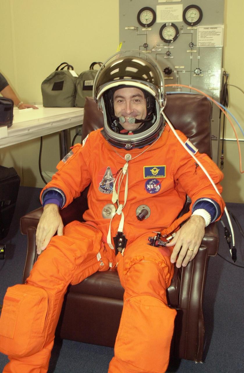 KENNEDY SPACE CENTER, FLA. -- STS-111 Mission Specialist Philippe Perrin gets ready in his launch and entry suit for a simulated launch countdown at the pad.  Perrin is with the French Space Agency.  The simulation is part of STS-111 Terminal Countdown Demonstration Test activities for the STS-111 crew and Expedition 5. The payload on the mission to the International Space Station includes the Mobile Base System, an Orbital Replacement Unit and Multi-Purpose Logistics Module Leonardo.  The Expedition 5 crew is traveling on Endeavour to replace the Expedition 4 crew on the Station.  Launch of Endeavour is scheduled for May 30, 2002.